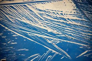 winter background with freezing water reflecting winter light photo