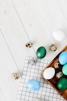 Easter church holiday colorful eggs on chalkboard and wooden table top view photo