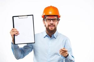 Business man construction hard hat with professional industry documents photo