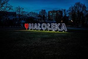 bright neon with the inscription Bialoleka in Warsaw in Poland in winter evening photo