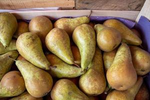 juicy pears on a stall forming a background photo