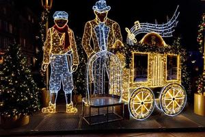 streets at night with decorations for Christmas Warsaw Poland in the city center photo