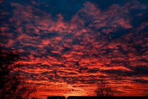 sky background after sunset with orange clouds photo