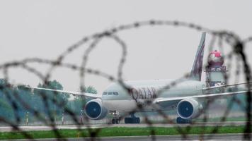 ALMATY, KAZAKHSTAN MAY 4, 2019 - Airfreighter Qatar Cargo Boeing 777 A7 BFK taxiing after landing. Almaty International Airport, Kazakhstan video