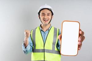 Asian engineer portrait on gray background photo