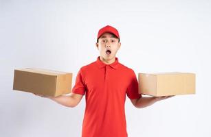 portrait of asian delivery man on white background photo