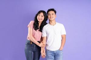 image of asian couple posing on purple background photo