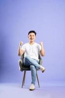 image of asian boy posing on purple background photo