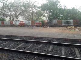 Rail line with station, while traveling by train, small stration , travell india photo