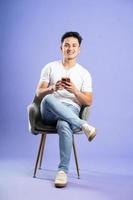 image of asian boy posing on purple background photo