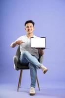 image of asian boy posing on purple background photo