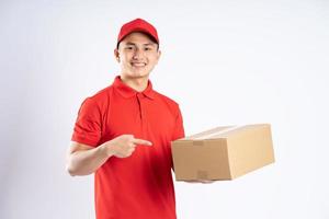 portrait of asian delivery man on white background photo