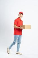portrait of asian delivery man on white background photo