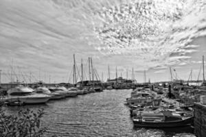 landscape with harbor and yachts on the spanish canary island of fuerteventura on a sunny day photo