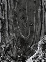 interesting abstract background pattern on a frozen puddle close-up photo