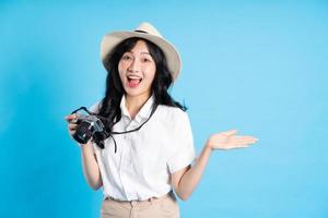 Portrait of beautiful asian girl traveling, isolated on white background photo