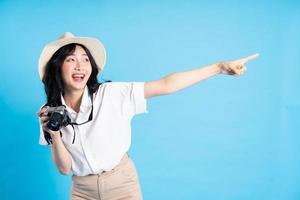 Portrait of beautiful asian girl traveling, isolated on white background photo