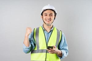 Asian engineer portrait on gray background photo