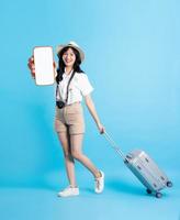 Portrait of beautiful asian girl traveling, isolated on white background photo