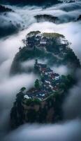 beautiful village In spring Jiangnan Cliff little Village surrounded by fog photo