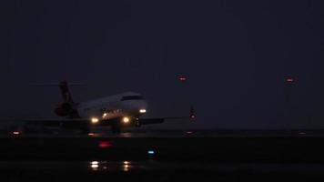 KAZAN, RUSSIA AUGUST 05, 2022 - Aircraft CRJ 200 Bombardier of UVT Aero speed up for takeoff at dusk, at night, at dawn. Russian regional airline video