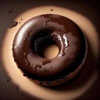 A chocolate doughnut with chocolate icing and a chocolate glaze photo