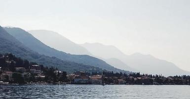 Mediterranean landscape with mountain silhouettes by the sea photo