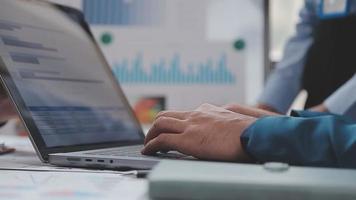 Financial analysts analyze business financial reports on a digital tablet planning investment project during a discussion at a meeting of corporate showing the results of their successful teamwork. video