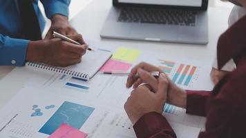 Financial analysts analyze business financial reports on a digital tablet planning investment project during a discussion at a meeting of corporate showing the results of their successful teamwork. video