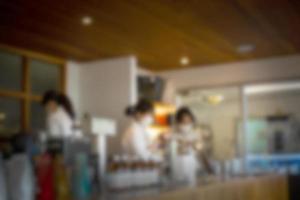 Abstract blurred coffee shop with barista photo