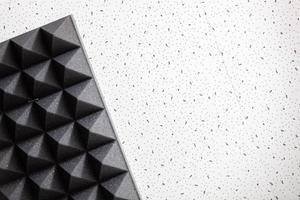Two backgrounds on one wall. Professional soundproofing and plain white wall in a light pattern. Texture. Background. Template. High quality photo. Horizontal photo