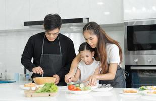 New home for family. activities together during the holidays. Parents and children are having activity on vacant time. weekend, enjoyment, happy family, togetherness, feel good. Kitchen photo