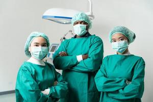portrait Medical team urgency in the hospital. Emergency doctor using defibrillator, ICU, electro pulse therapy, emergency room, resuscitation, cardiac arrest, danger, heart, surgeon, cardiology photo