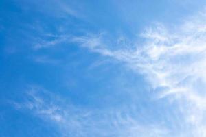 Natural white cirrus clouds on blue sky. Beauty of bright blue and white skyscape. photo