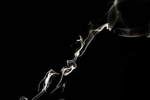 Smoke effect texture. Isolated background. Black and dark backdrop. Smokey fire and mistic effect. photo