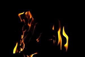 Fire flame texture. Burning material backdrop. Burn effect pattern. Blaze and torch wallpaper. Heat and haze backdrop. photo