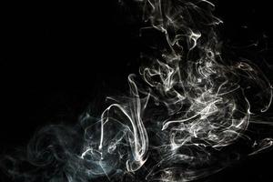 Smoke effect texture. Isolated background. Black and dark backdrop. Smokey fire and mistic effect. photo