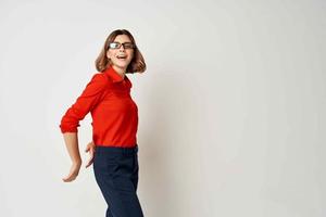 Business woman in red shirt emotions posing light background photo