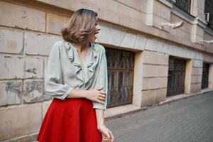 woman outdoors in red skirt outdoors lifestyle photo