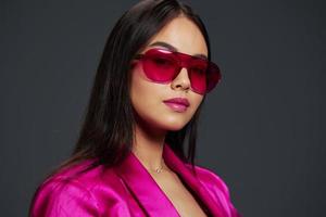 woman in pink dress red glasses fashion makeup glamor isolated background photo
