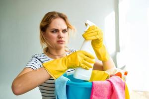 Woman holding in hand detergent cleaning house care lifestyle photo