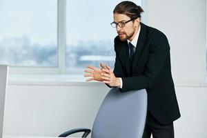 man in a suit near the desktop office computer Lifestyle photo