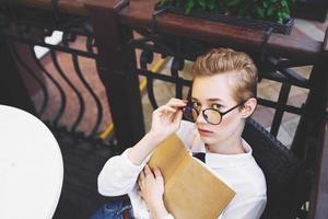 short haired woman reading walk in the fresh air communication photo