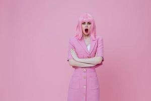 Young positive woman gesturing with hands pink jacket lifestyle glamor monochrome shot unaltered photo