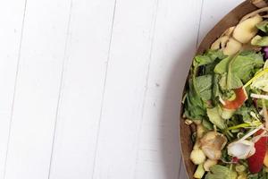 Organic garbage for compost on a wooden background with copy space. Composting concept flat lay, top view photo