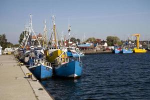old operational fishing boats on a sunny day in the port of Poland photo
