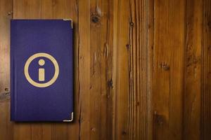 Information book on a wooden desk photo