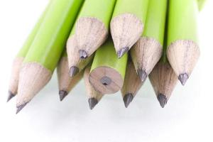 green prepared pencils on white isolated background photo