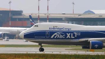 MOSCOW, RUSSIAN FEDERATION JULY 29, 2021 - Freight carrier Boeing 747 AirBridgeCargo taxiing on the runway at Sheremetyevo airport SVO. Cargo plane, close up video