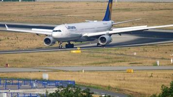 FRANKFURT AM MAIN, GERMANY JULY 19, 2017 - Lufthansa Airbus A330 taxiing after landing on runway 25R. Fraport, Frankfurt, Germany video